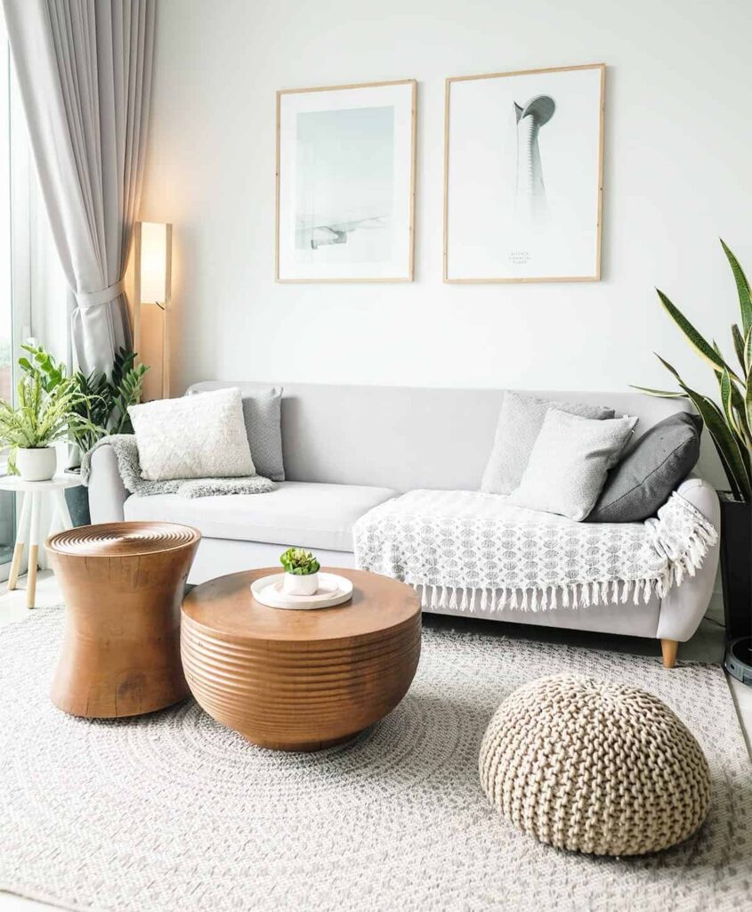 Bright organized entryway with wooden shelving and neutral woven baskets