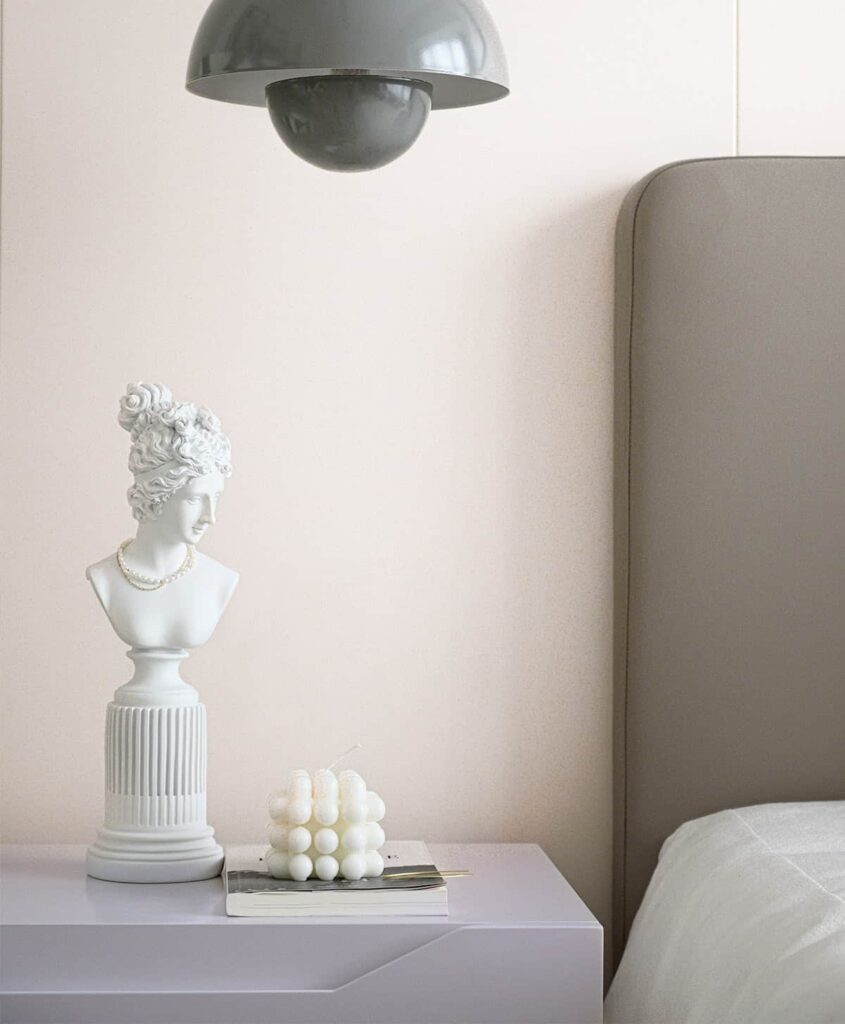 Calm bedroom corner with tidy storage baskets and folded stacked linens