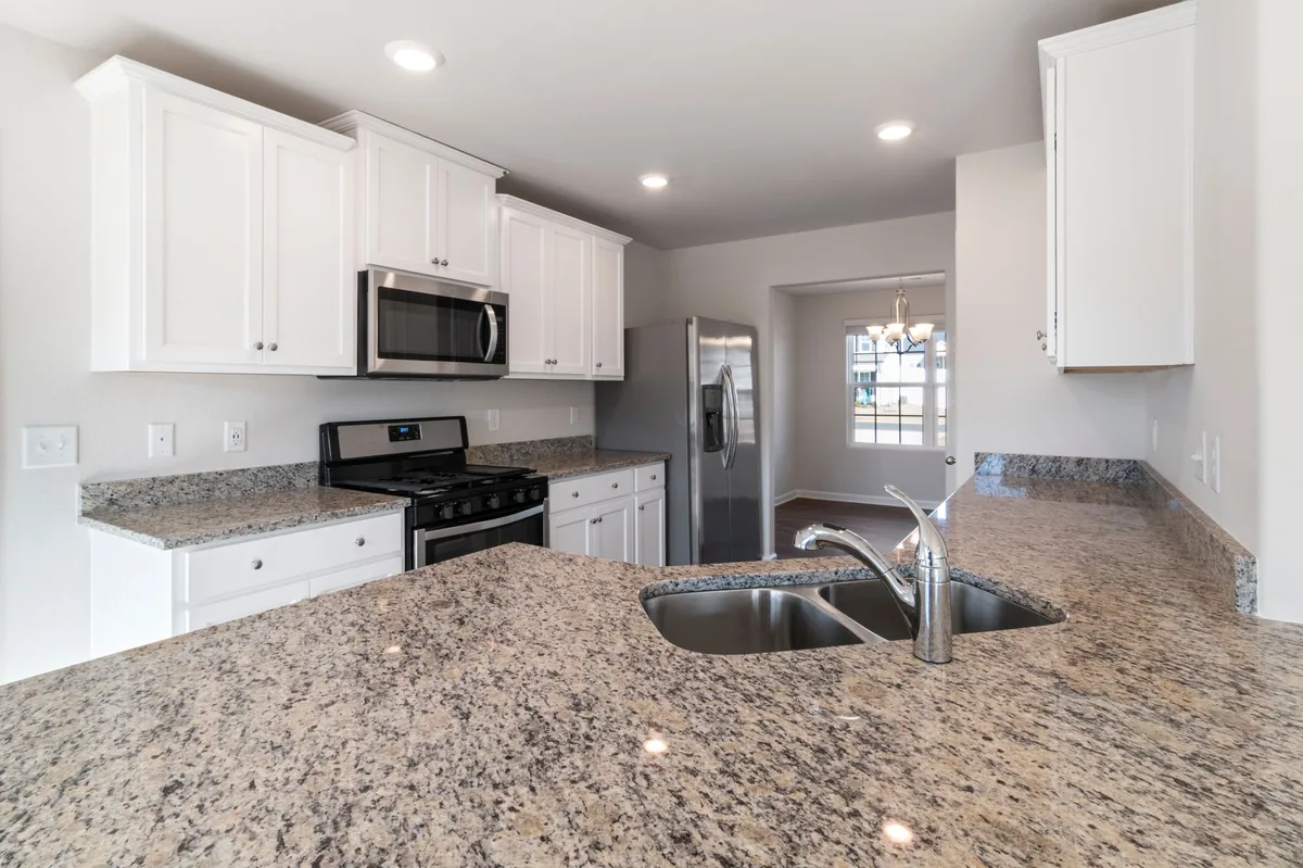 Clear counter used as staging space while a cupboard is emptied